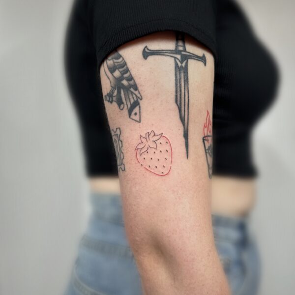simple strawberry red ctrlaltz tattoo